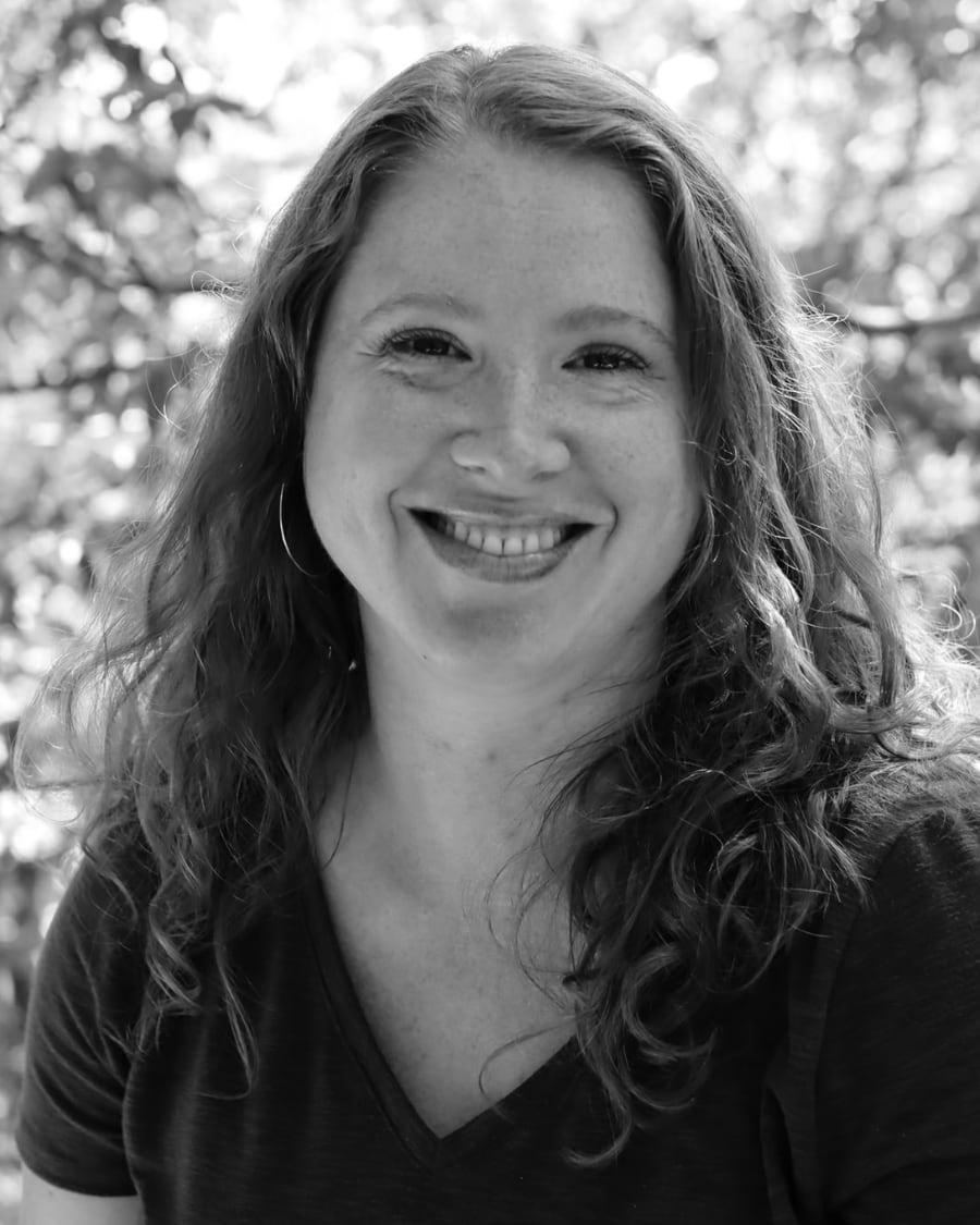Larissa Lyons, lead singer of Citadel Worship, smiling outdoors among trees